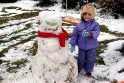 #16 Eloise and the snowman she built at home.